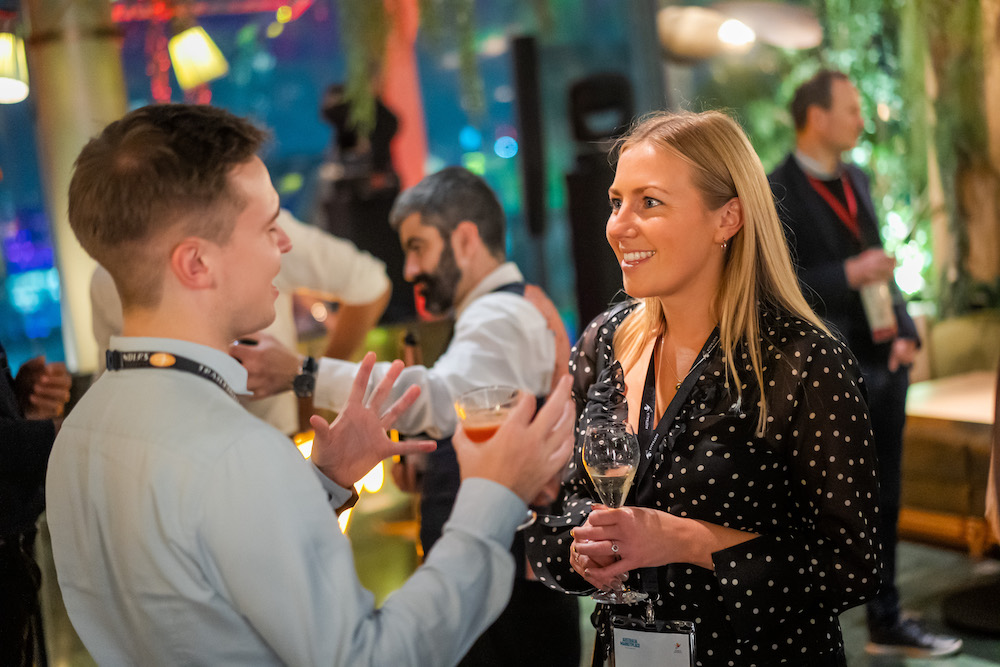 two people talking at event