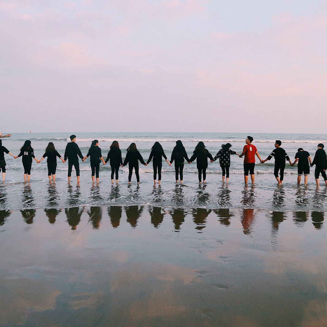Canva---Team-Holding-Their-Hands-On-Seashore (1)-1